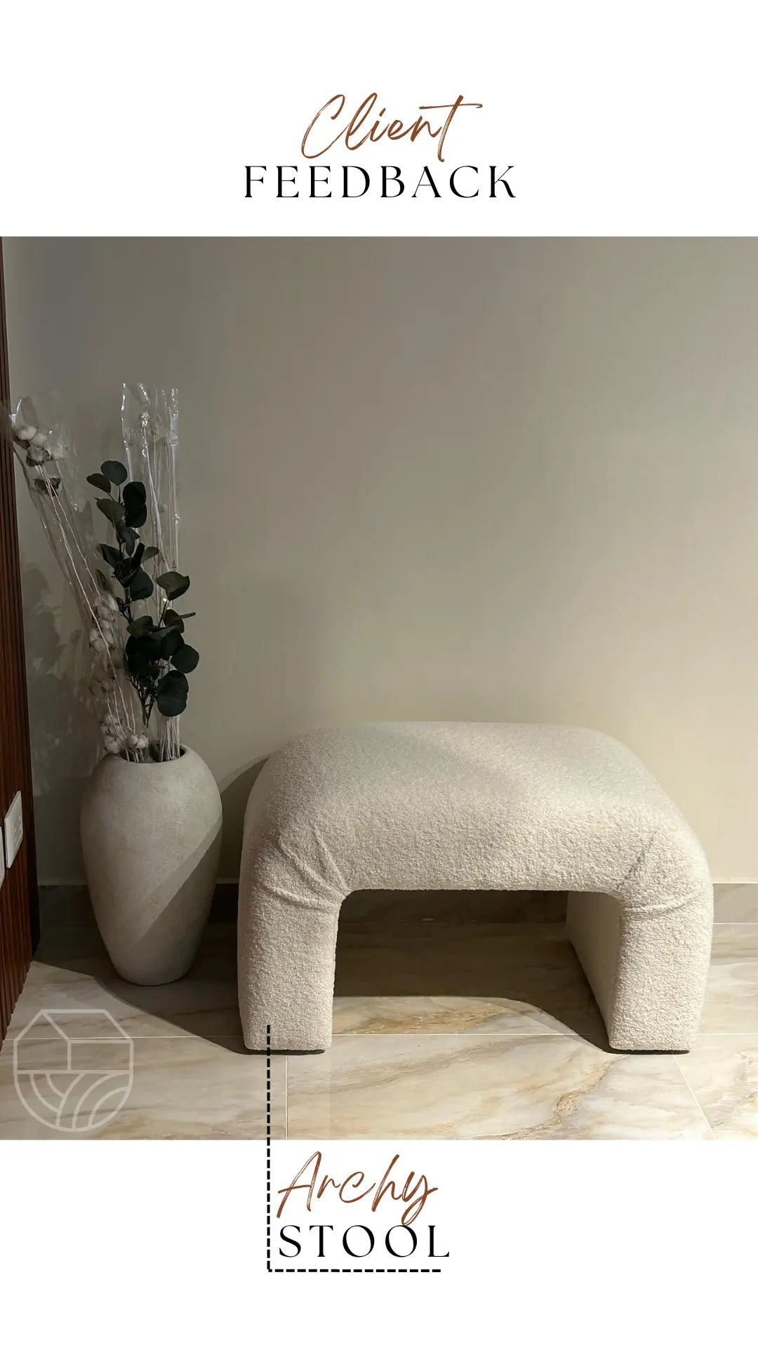 Beige cushioned stool in a minimalistic room with a vase and plant.