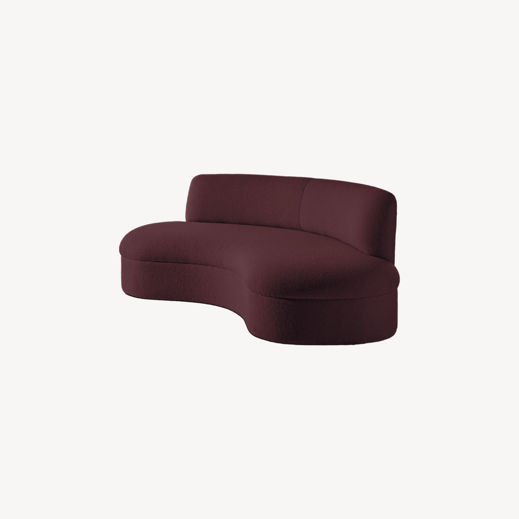 Maroon curved sofa on a white background