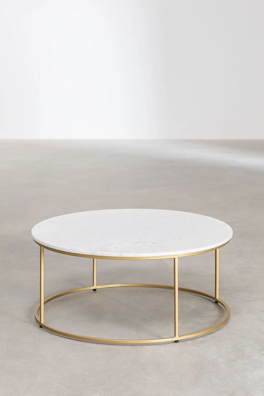 Round coffee table with marble top and gold metal frame on a neutral background