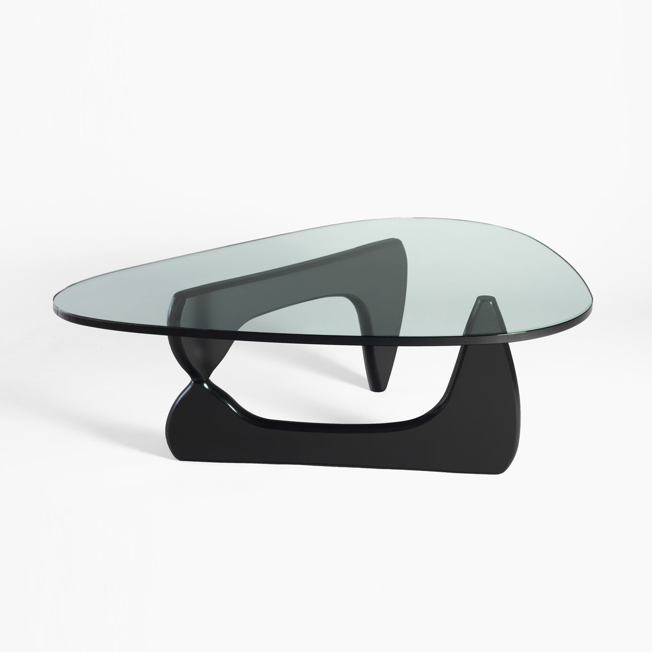 Modern coffee table with glass top and black base on a white background