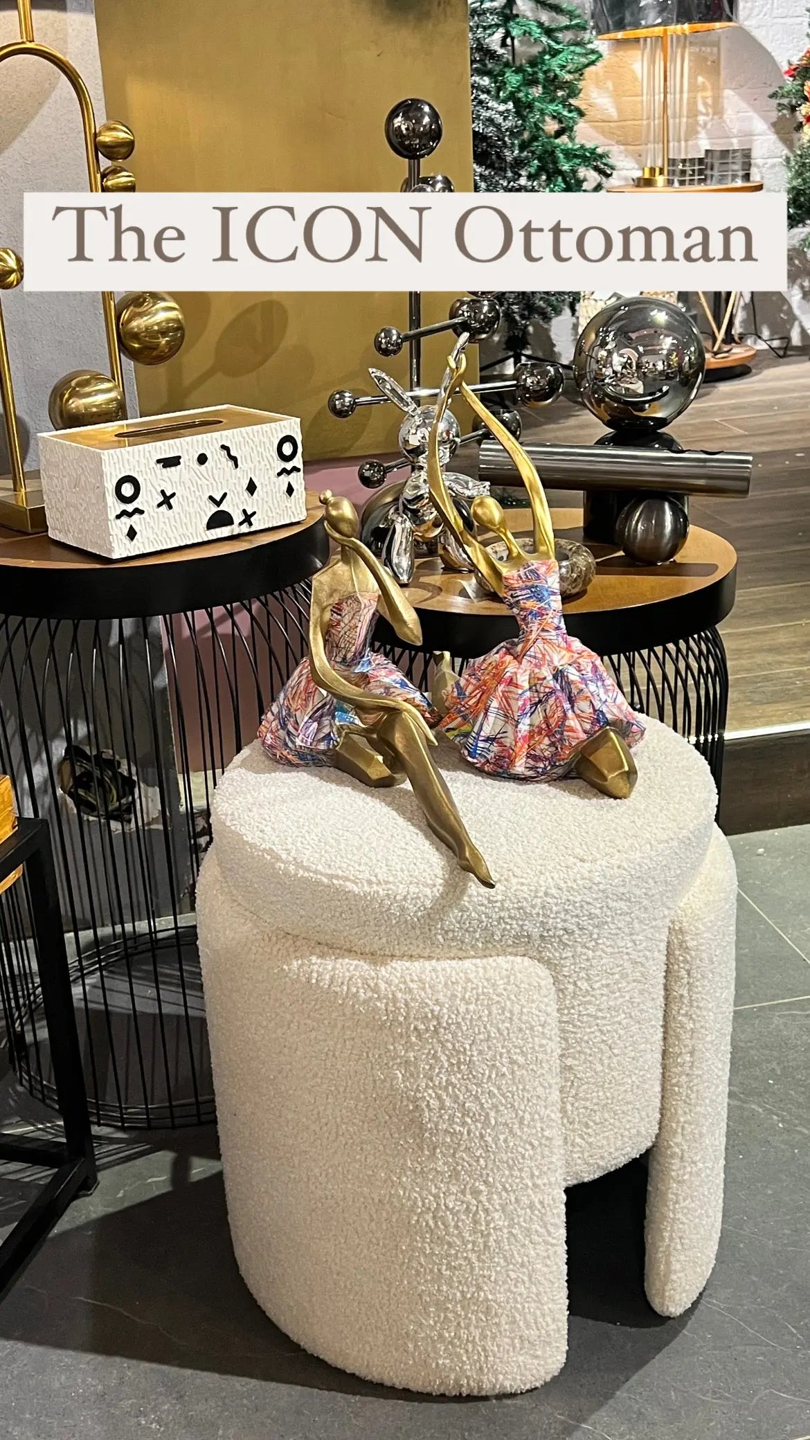 Beige ottoman with decorative items on a stylish background