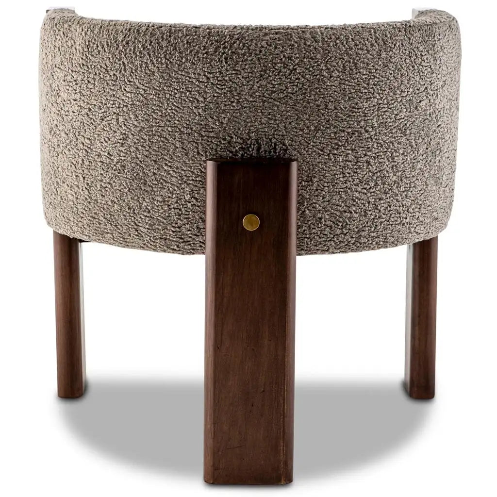 Small chair with textured brown backrest and wooden legs on a white background