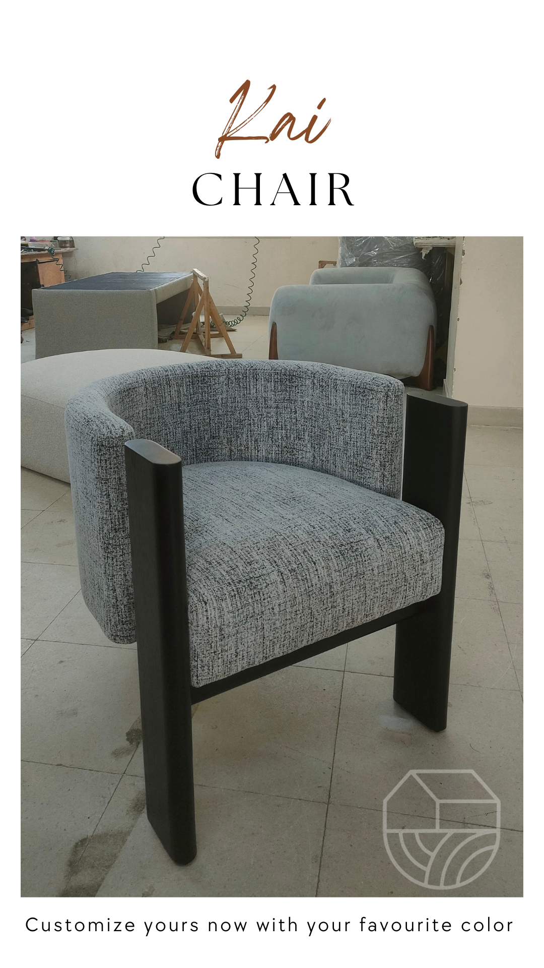 Gray upholstered chair with black frame on a white background