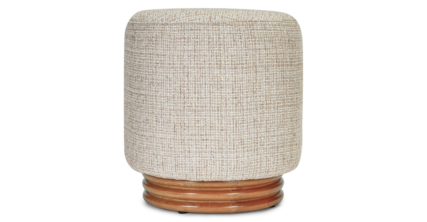 Textured cylindrical stool with wooden base on a white background